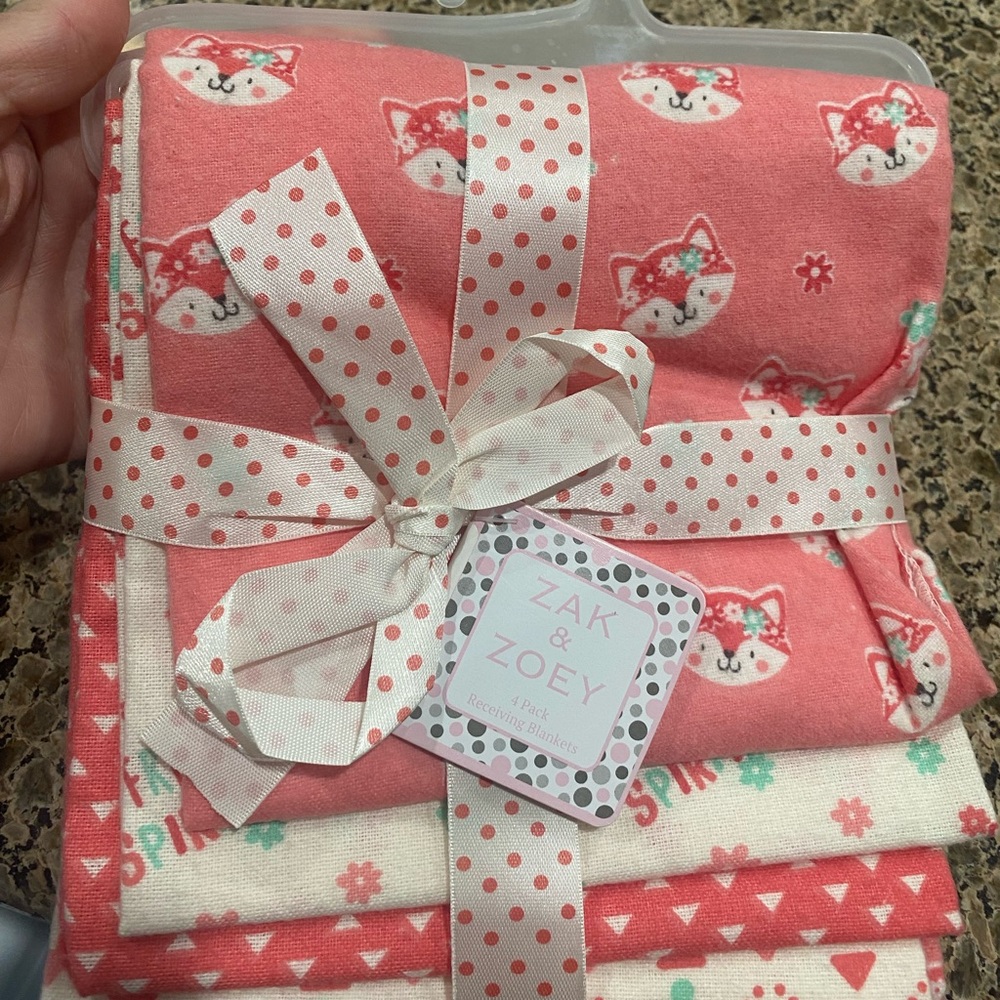 Baby girl receiving blankets